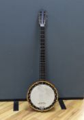 A six string banjo, unmarked, in a hard case by Ashbury