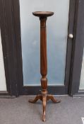 A George III style mahogany torchere, height 136cm