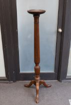 A George III style mahogany torchere, height 136cm