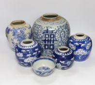 A group of four Chinese blue and white jars and a bowl, together with a similar Japanese jar,