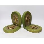 A pair of Asprey green leather and brass stirrup book-ends, 19.5cm