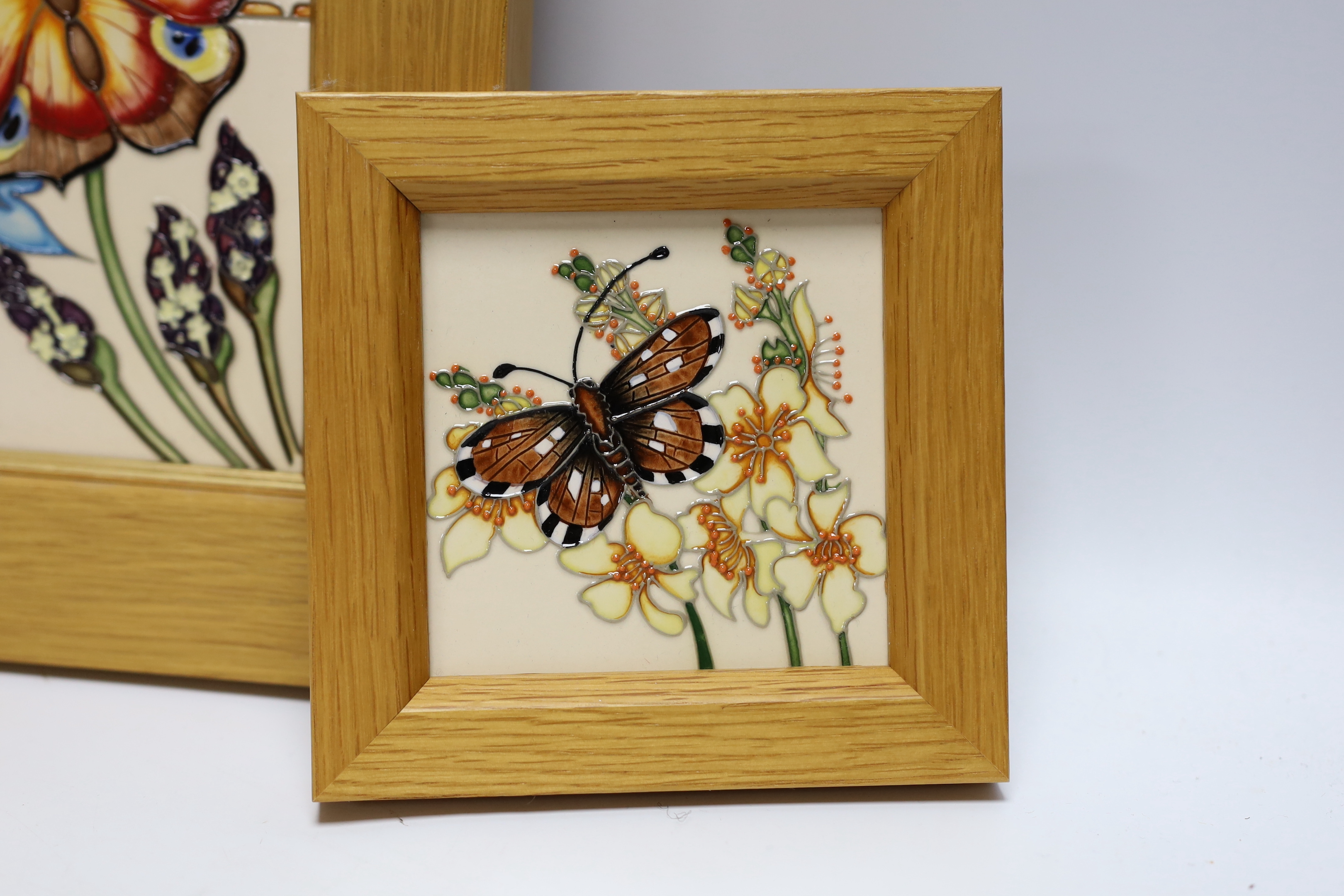 A Moorcroft Rachel Bishop wall plaque of butterflies and a similar smaller plaque, both in oak - Image 2 of 4