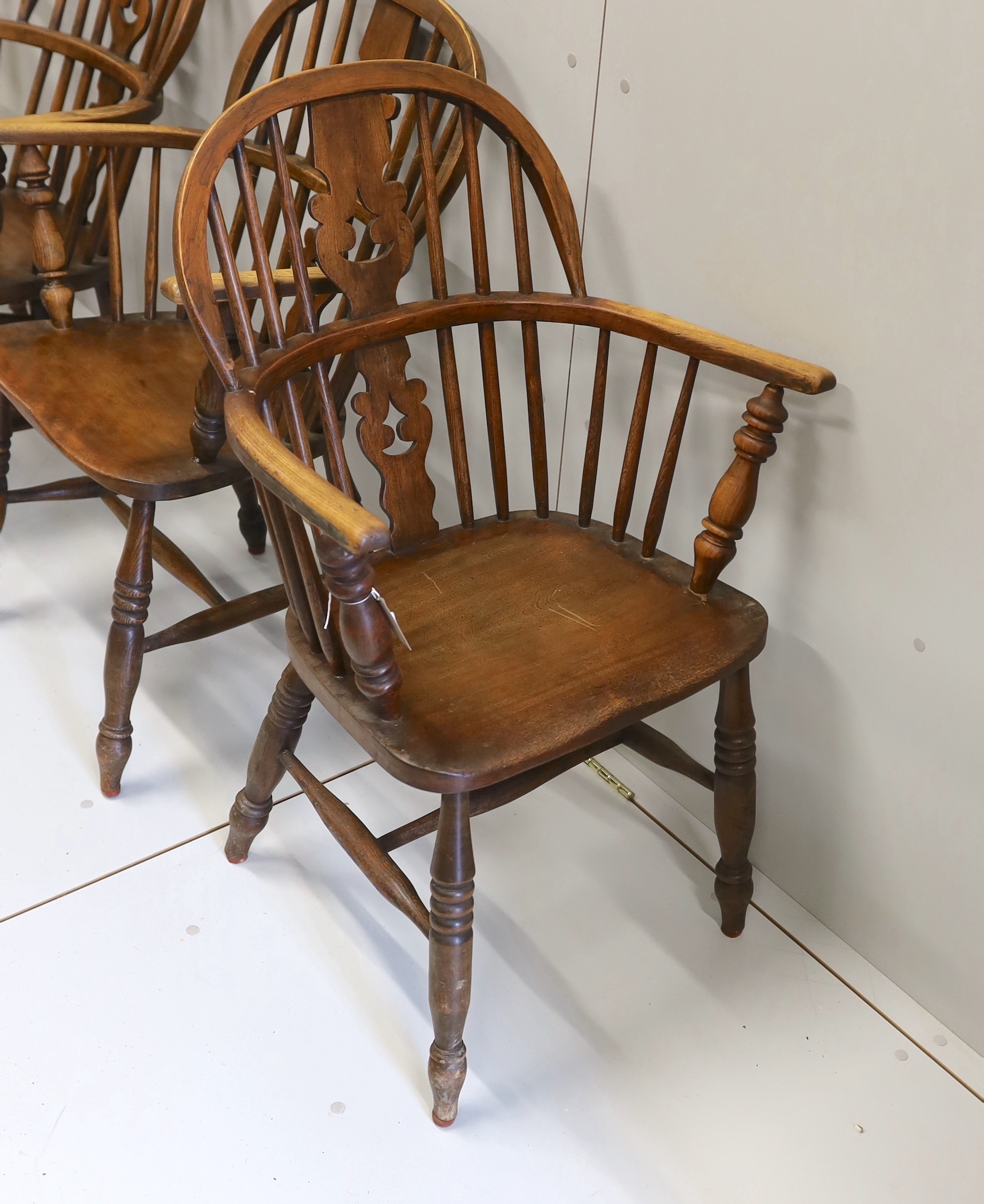 A near set of four 19th century Nottingham area elm, ash and beech Windsor elbow chairs, possibly by - Image 4 of 4