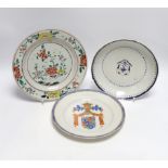 A Chinese famille rose plate together with two armorial or crested dishes, 23cm diameter