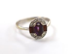 A modern Art Deco style 9ct white gold, amethyst and diamond chip set cluster ring, size Q/R,