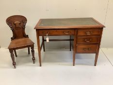 An early 20th century mahogany and beech four drawer kneehole writing desk, width 107cm, depth 60cm,