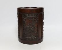 A heavy Chinese wooden brush pot decorated with birds, possibly Zitan, 20cm high