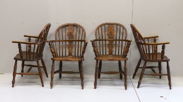 A near set of four 19th century Nottingham area elm, ash and beech Windsor elbow chairs, possibly by