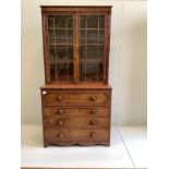 A Regency mahogany secretaire bookcase, the interior with turned ivory handles, width 106cm, depth