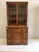 A Regency mahogany secretaire bookcase, the interior with turned ivory handles, width 106cm, depth