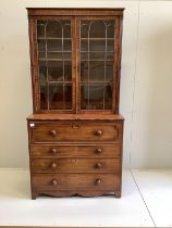 A Regency mahogany secretaire bookcase, the interior with turned ivory handles, width 106cm, depth