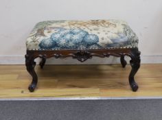 A Victorian carved mahogany dressing stool, re-upholstered in a William Morris-designed fabric,