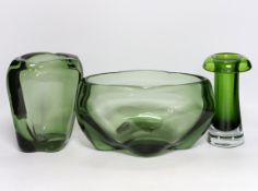 Two Whitefriars green glass vases, designed by James Hogan, and one other, largest 27cm wide