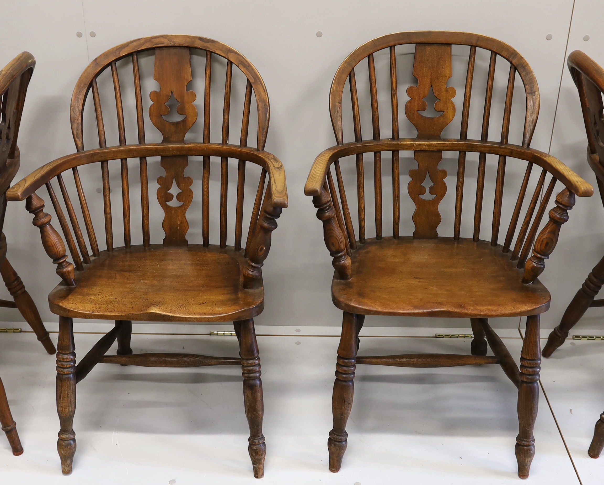 A near set of four 19th century Nottingham area elm, ash and beech Windsor elbow chairs, possibly by - Image 3 of 4