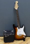 A Squier Strat by Fender Sunburst electric guitar made in China with rosewood neck, together with