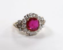 A yellow metal, singe stone round cut synthetic ruby and diamond set circular cluster dress ring,