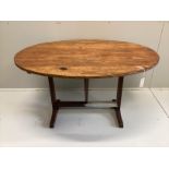 A 19th century French oval pine and fruitwood Vigneron, width 125cm, depth 101cm, height 72cm