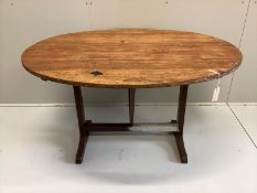 A 19th century French oval pine and fruitwood Vigneron, width 125cm, depth 101cm, height 72cm