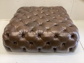 A large contemporary Victorian style buttoned brown leather footstool, originally retailed by