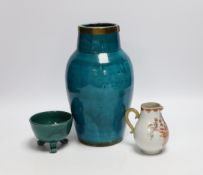 A turquoise glazed three footed bowl and jug and a small Chinese famille rose jug, largest 25cm