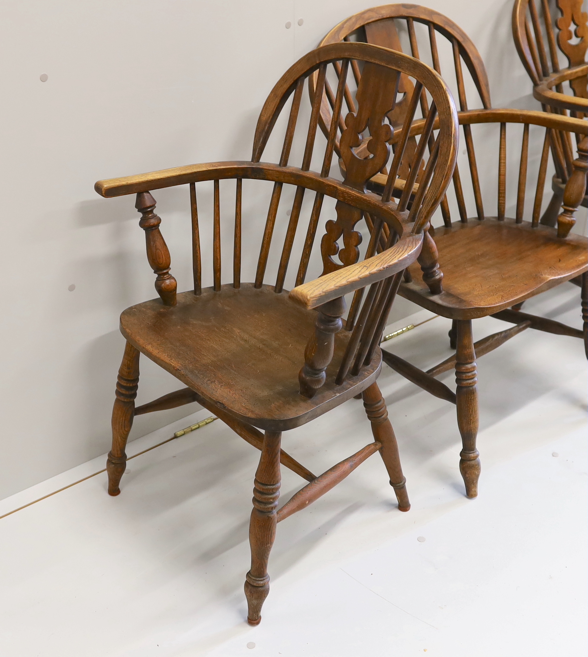 A near set of four 19th century Nottingham area elm, ash and beech Windsor elbow chairs, possibly by - Image 2 of 4