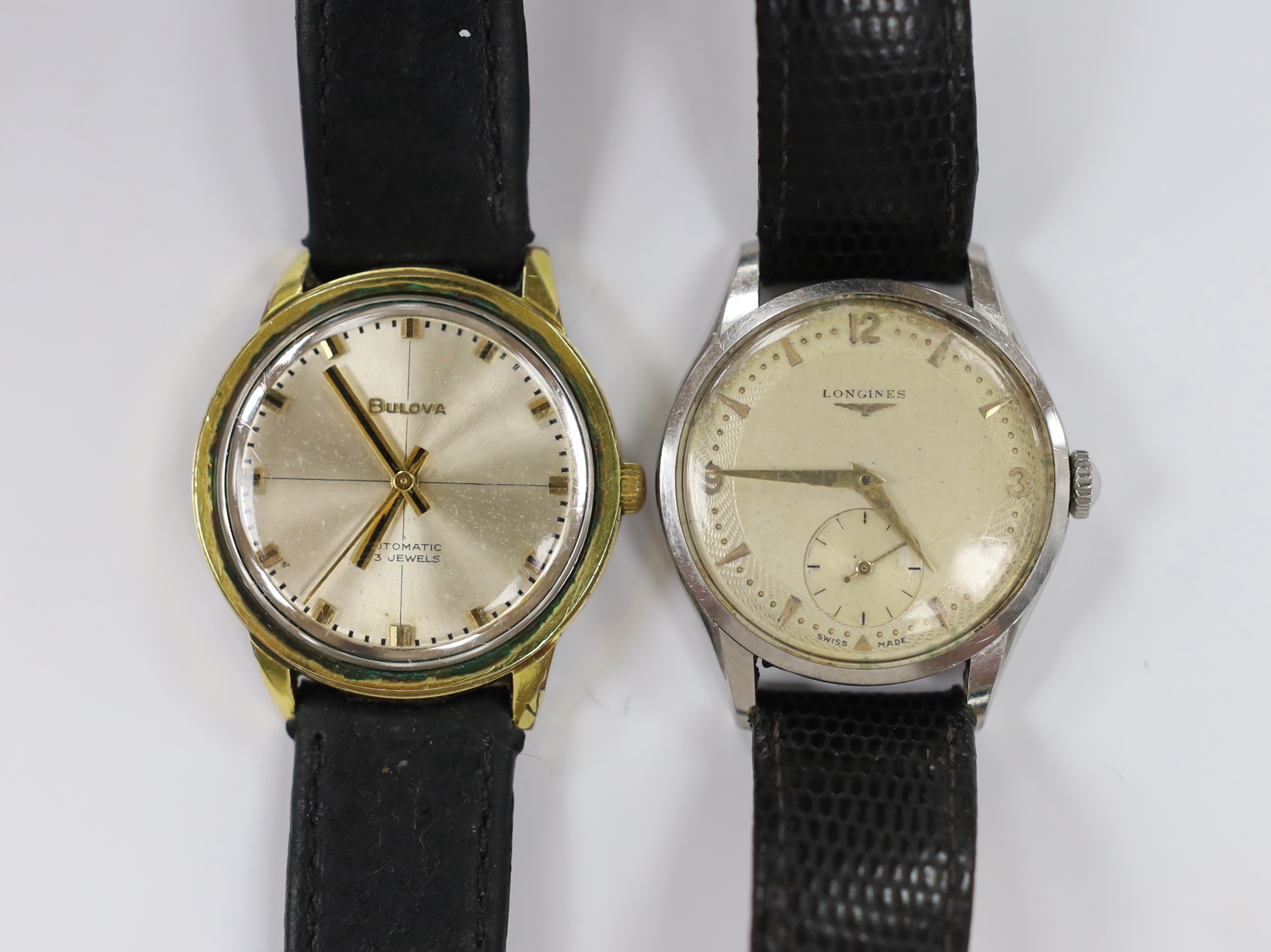 A gentleman's 1950's stainless steel Longines manual wind wrist watch, with case back inscription