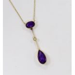 An Edwardian 15ct, two stone amethyst and single stone split peal set drop pendant necklace, overall