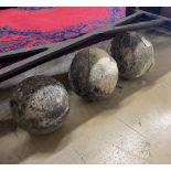 A trio of graduated reconstituted weathered stone ball finials, largest height 37cm