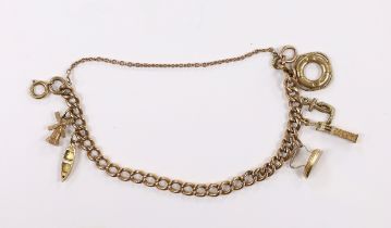 A 9ct curb link charm bracelet, hung with six assorted charms, including five 9ct gold, gross weight