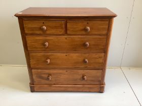 A Victorian mahogany chest of two short and three long drawers, fitted with turned mahogany handles,