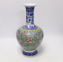 A Chinese famille rose vase, decorated with peaches and flowers, 35cm high