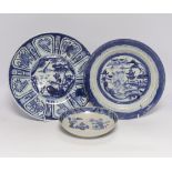 Two Chinese blue and white plates and a similar shallow bowl, largest 26cm high