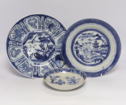 Two Chinese blue and white plates and a similar shallow bowl, largest 26cm high