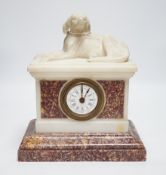 A 19th century French alabaster and rouge marble ‘hound’ mantel timepiece, 29cm tall