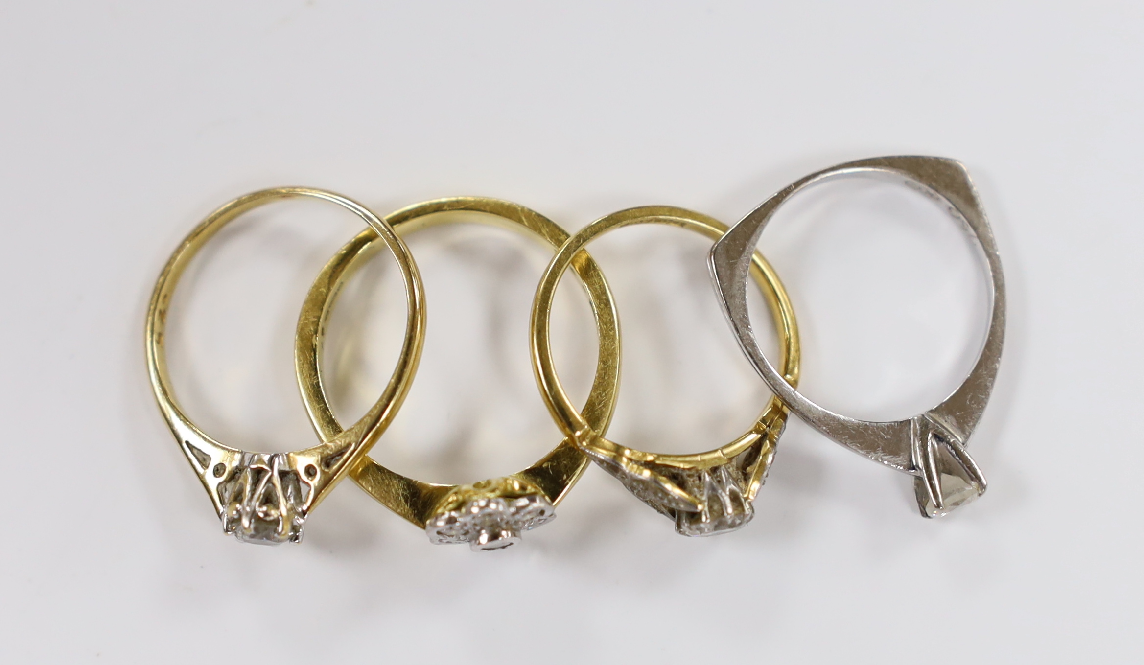 Three assorted 18ct and solitaire diamond rings and an 18ct gold and diamond set flower head ring, - Image 2 of 2