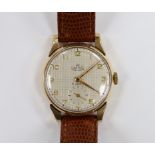 A gentleman's 9ct gold Smiths Deluxe manual wind wrist watch, on later leather strap, case