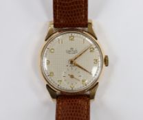 A gentleman's 9ct gold Smiths Deluxe manual wind wrist watch, on later leather strap, case