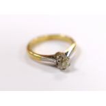 A yellow metal and solitaire diamond set ring, size G/H, gross weight 2.7 grams.