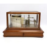 A 20th century barograph by Tycos, in a mahogany case with bevelled glass panels and incorporating