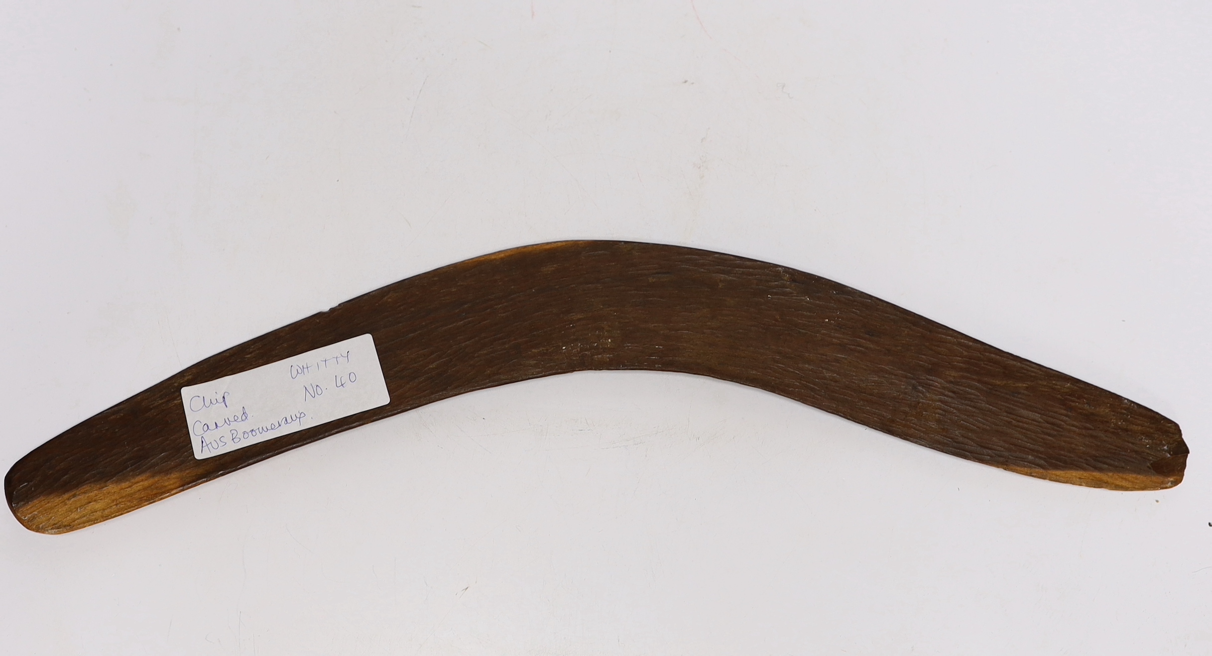 A chip carved Australian boomerang, 53cm in length - Image 2 of 2