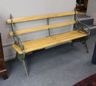 A Victorian Coalbrookdale 'lily pad' pattern cast iron garden bench restored with later ash slats,