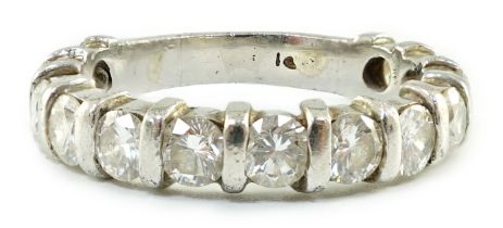 An 18ct white gold and thirteen stone round brilliant cut diamond set three quarter eternity ring,