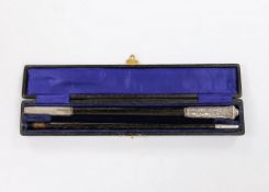 A cased George V silver mounted conductor's baton, two part baton with threaded joint, engraved