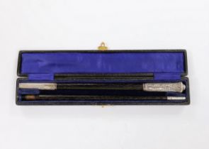 A cased George V silver mounted conductor's baton, two part baton with threaded joint, engraved