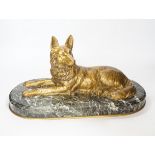 A recumbent dog gilt bronze on marble plinth, style of Chiparus, 40cm long
