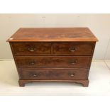 A George III mahogany chest of two short and two long drawers, raised on bracket supports, width