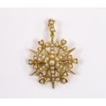 An Edwardian yellow metal and split pearl cluster set starburst pendant brooch, overall 38mm,