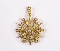 An Edwardian yellow metal and split pearl cluster set starburst pendant brooch, overall 38mm,