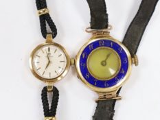 A lady's early 1960's 9ct gold Omega manual wind wrist watch, on a twin strand fabric strap,