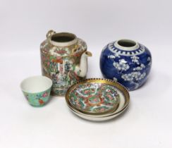 A collection of Chinese ceramics including a blue and white prunus flower jar, a famille rose teapot